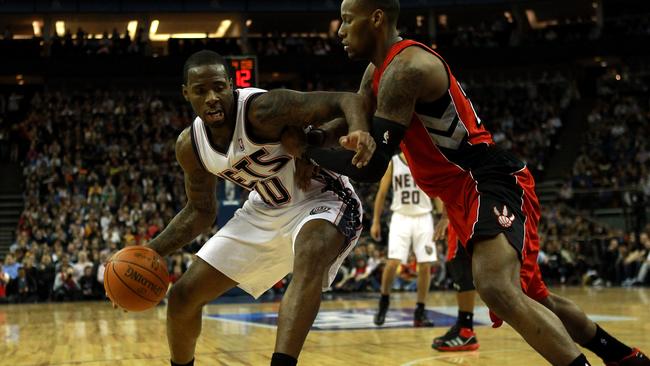 Damion James of the Nets fends of Sonny Williams of the Raptors during the NBA match between New Jersey Nets and the Toronto Raptors.