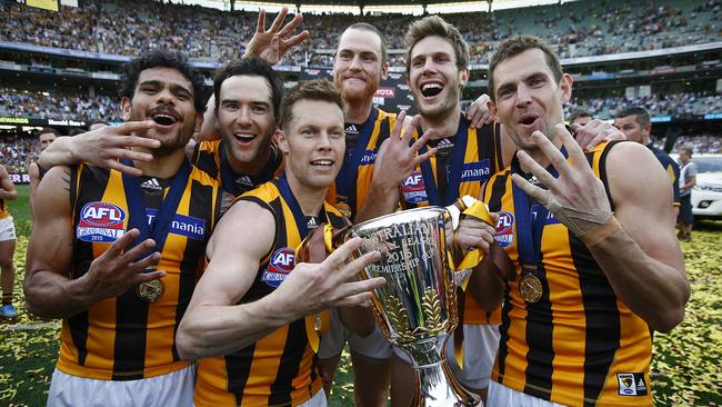 Jarryd Roughead (back) with four-time premiership teammates (from left) Cyril Rioli, Jordan Lewis, Sam Mitchell, Grant Birchall and Luke Hodge Picture: Wayne Ludbey