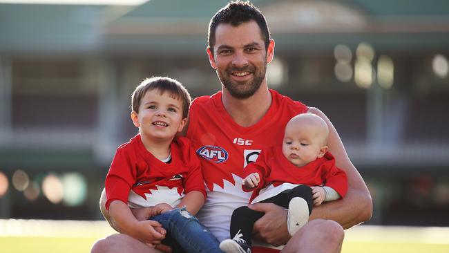 Heath Grundy with his kids baby Jameson (four months) and Reg, 3. Picture: Phil Hillyard