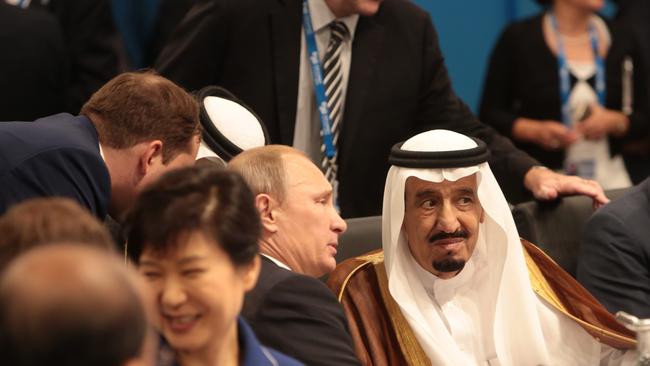 Russia's President Vladimir Putin chats to Saudi Arabia's Crown Prince Salman bin Abdulaziz chat before the Open Plennary Session at the G20 Leaders' Summit in Brisbane. (Andrew Taylor/G20 Australia)