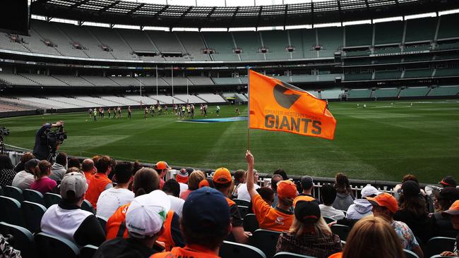 A crowd of about 200 Giants fans watch their side train at the MCG. Picture: Phil Hillyard