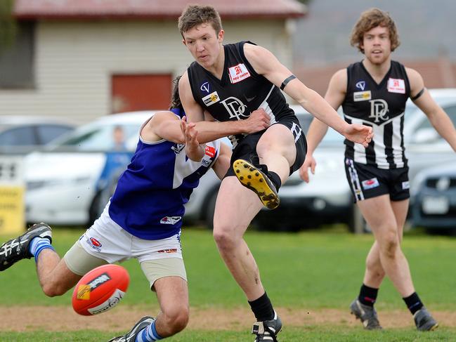 Luke Delahey sneaks a kick away under pressure for Darley. Picture: Josie Hayden