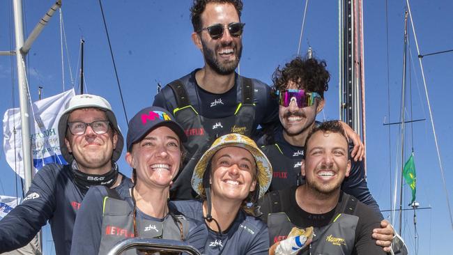 Jessica Watson (centre) with crew members Sam Duncan, Annie Eastgate, Jack Kliner, Steve Quiros and Xavier Doerr after arriving at Hobart onboard the Azzurro. Picture: Chris Kidd