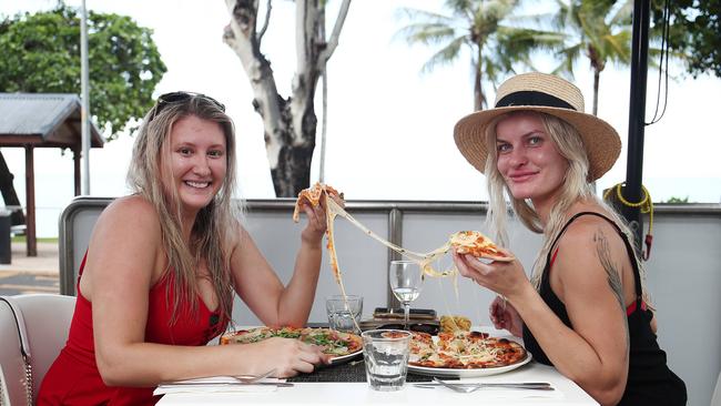 Shinae West and Dayna Ashe enjoy a couple of delicious pizzas for lunch at Lunico restaurant at Trinity Beach. Picture: Brendan Radke