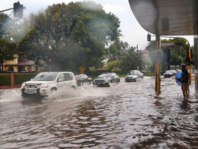 Heavy flooding on the corner of St Kilda and Grosvenor streets in Brighton. Picture: Hamish Blair