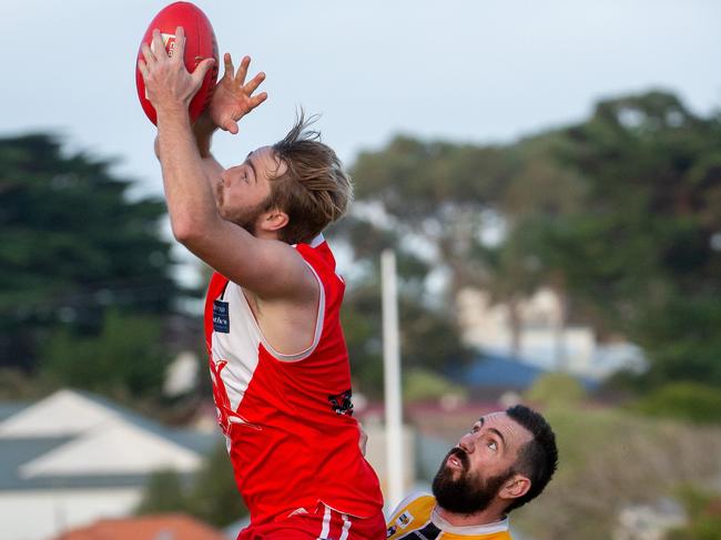 Leigh Poholke marks in front of Frankton YCW's Byron Barry. Picture: Jay Town