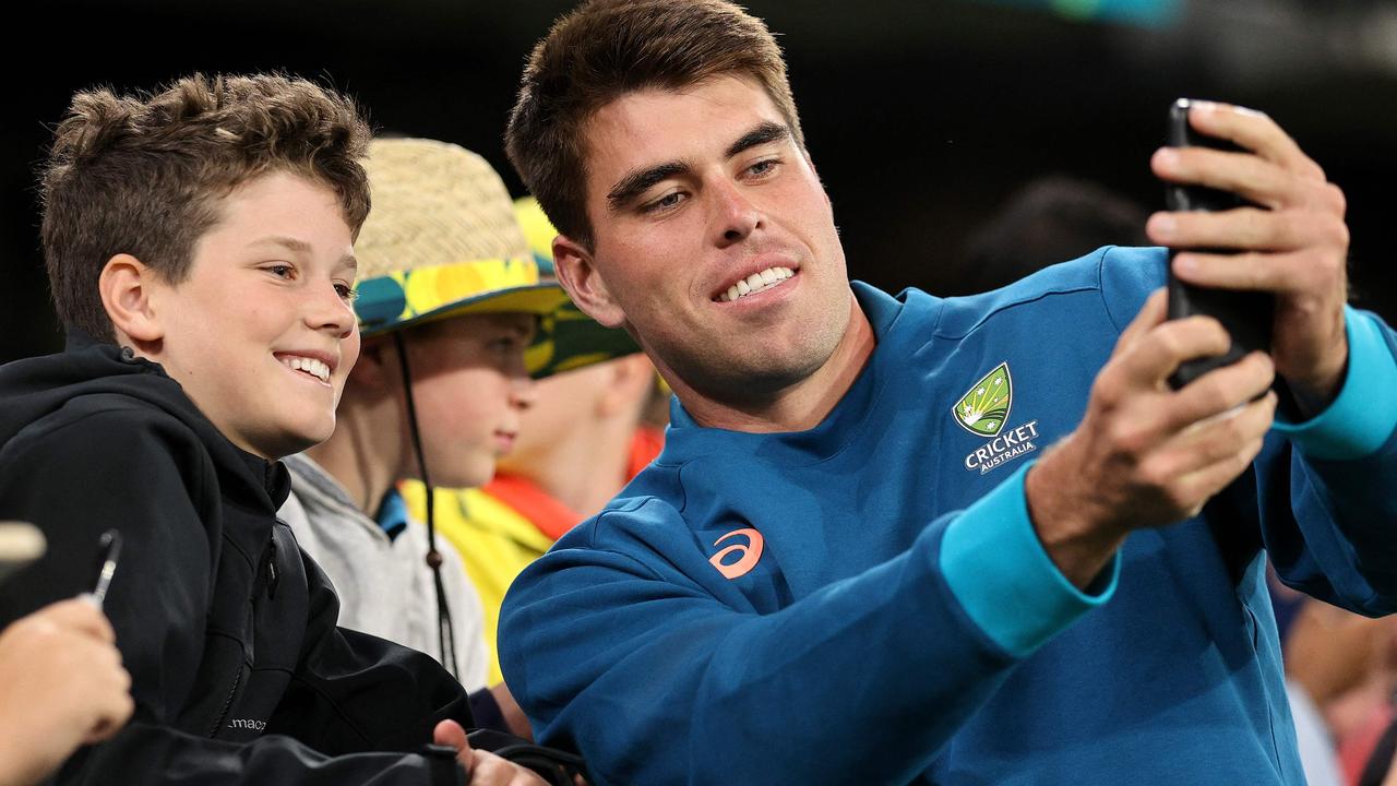 Australia's Xavier Bartlett poses for a selfie with fans. Photo by Martin KEEP / AFP