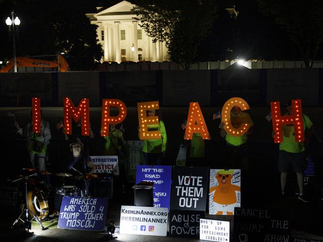 Protesters with "Kremlin Annex" call to impeach President Donald Trump in Lafayette Square Park in front of the White House in Washington. Picture: AP