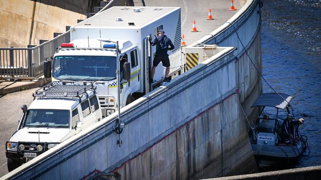 SA Police officers arrive to search for missing man Jeff Mundy at Myponga Reservoir. Picture: Naomi Jellicoe