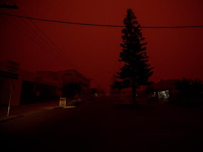 A darken and red glow engulfs Eden at 8.30am today. Picture: Gary Ramage