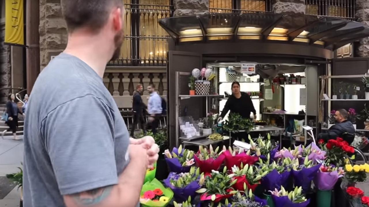 The man in the wheelchair was simply sitting talking to the florist. Picture: Torch of Christ Ministries