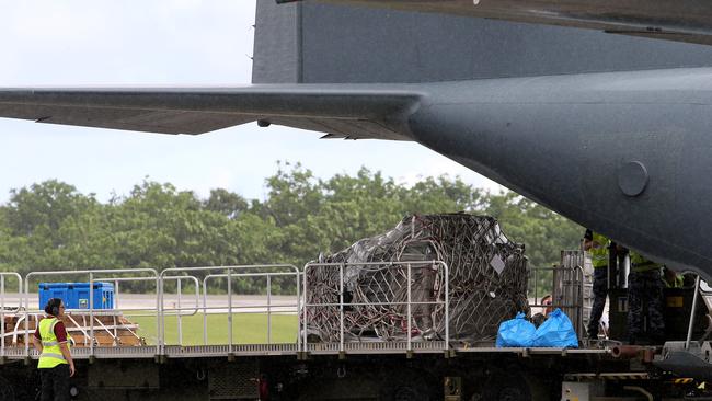 A RAAF plane delivers equipment for North West Point Detention Centre. Picture: Colin Murty