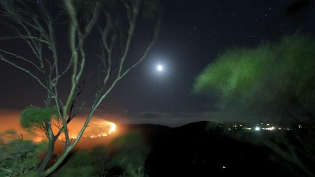 Bushfires burn in the Blue Mountains near the Three Sisters on Sunday night. Picture: Hazelbrook Rural Fire Brigade