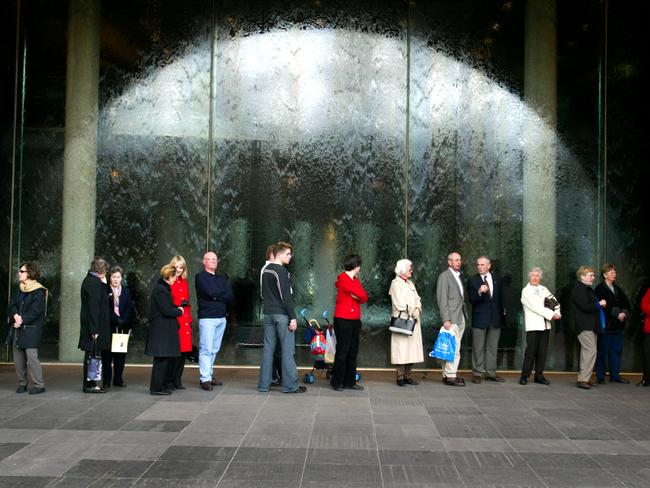 People queue outside National Gallery of Victoria (NGV) in Melbourne, keen to viewThe Impressionists Exhibition.