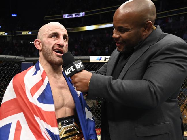 Alex Volkanovski already rates as one of the best fighters of all time, says UFC legend Daniel Cormier (right). Picture: Jeff Bottari/Zuffa LLC