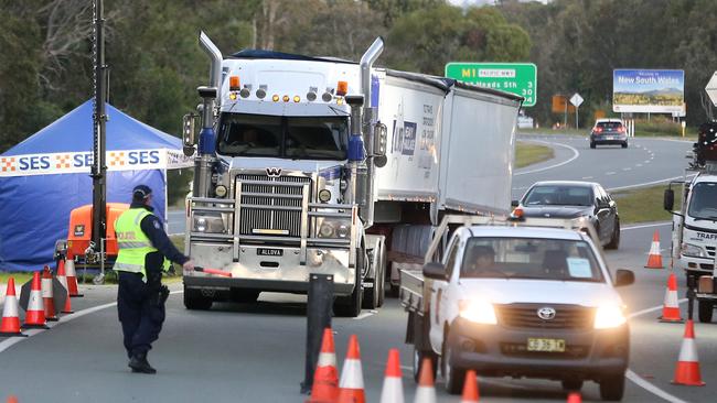 Truckies passing through the Queensland border at Coolangatta. Picture: Richard Gosling.