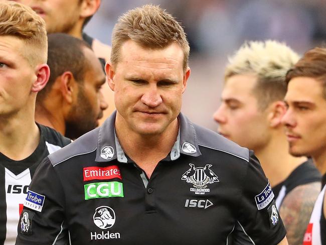 MELBOURNE, AUSTRALIA - JULY 08:  Nathan Buckley, coach of the Magpies speaks to his team during a quarter time break during the round 16 AFL match between the Collingwood Magpies and the Essendon Bombers at Melbourne Cricket Ground on July 8, 2017 in Melbourne, Australia.  (Photo by Scott Barbour/Getty Images)