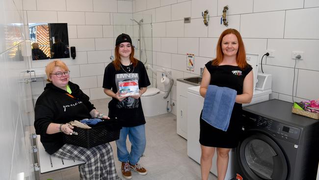 Sharehouse CEO Lisa Hammond with Spencer and Nova Raisherook at the organisation's new shower and laundry facilities. Picture: Evan Morgan