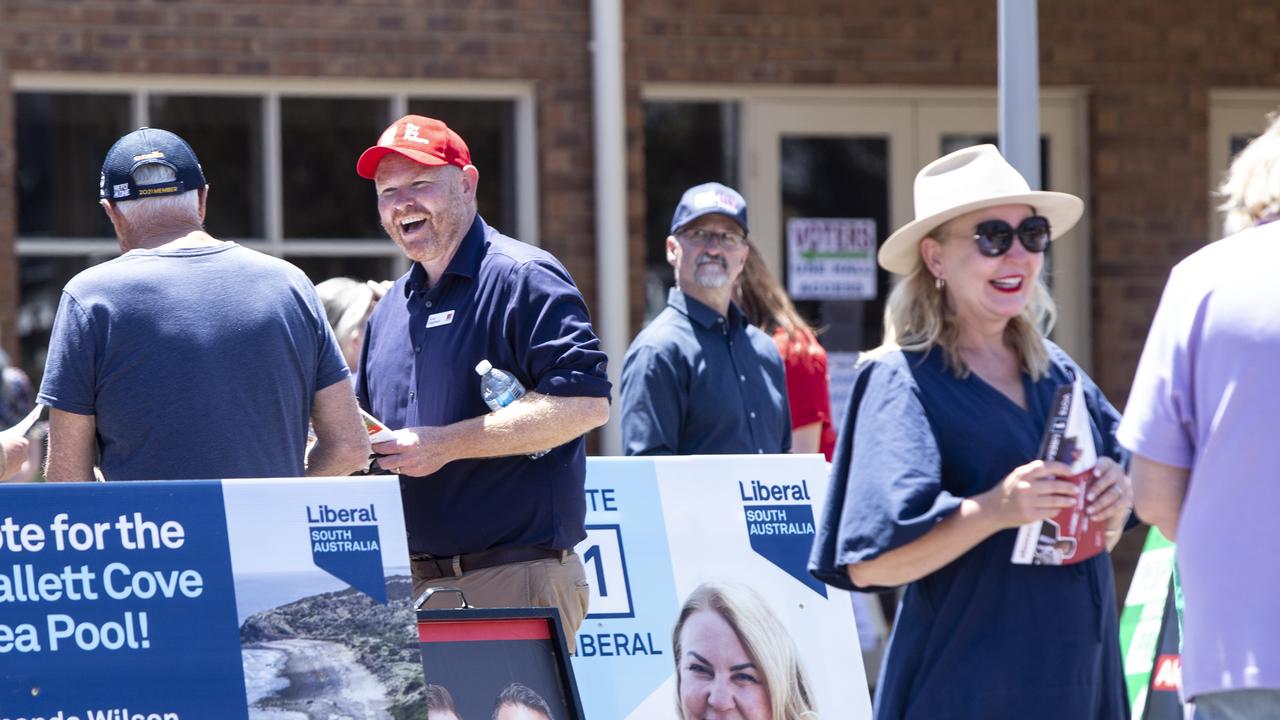 Labor Candidate Alex Dighton and Liberal Candidate Amanda Wilson speak to people voting in the Black by-election on November 12. Picture: Brett Hartwig.