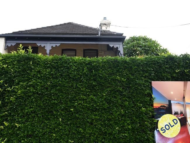 A for sale sign is displayed in front of a house in Sydney on Wednesday, April 26, 2017. (AAP Image/Paul Miller) NO ARCHIVING