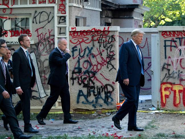 The President walks back to the White House escorted by the Secret Service after appearing outside of St John's Episcopal church across Lafayette Park in Washington, DC, after days of anti-racism protests against police brutality that erupted into violence. Picture: AFP