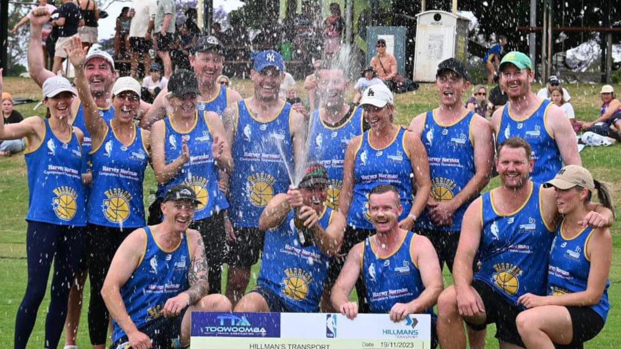 Warriors players celebrate winning the 2023 Elite Masters touch competition.