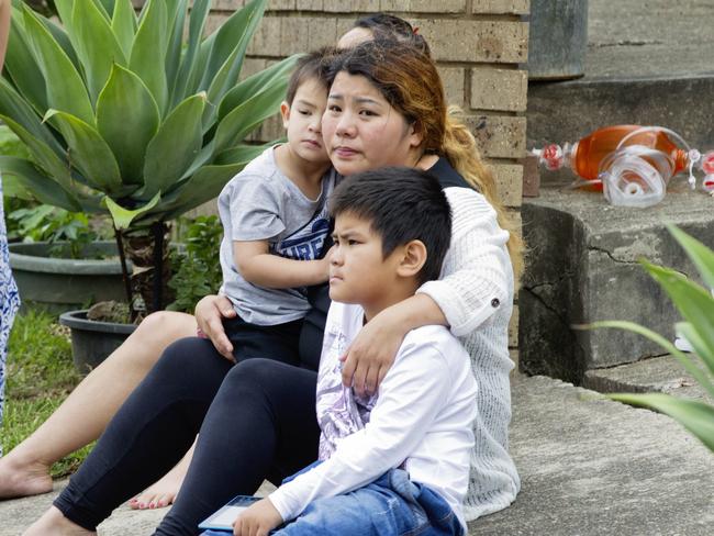 Relatives of Henry Tran, 2, at his Fairfield home where he was found in a pond. Picture: Jenny Evans