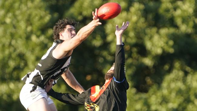 Belgrave’s Kurt Weiser reaches for the ball. Picture: Valeriu Campan