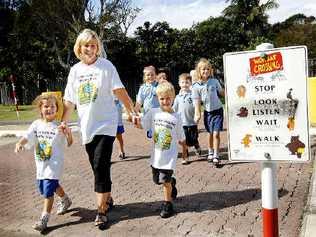 Byron Bay Public School kindy teacher Tracey Barnes, with Iliana Gelagotis, 5, (front left) and Ralph Hoult, 5, participating in the National Walk Safely to School Day. . Picture: DAVID NIELSEN