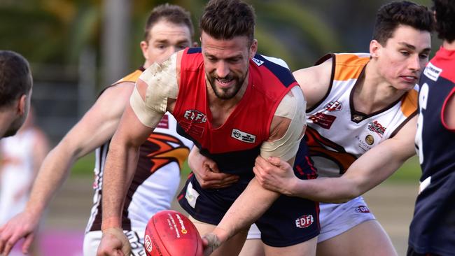 Tullamarine's Adam Scott looks to fire off a handball on Saturday. Picture: Jamie Morey