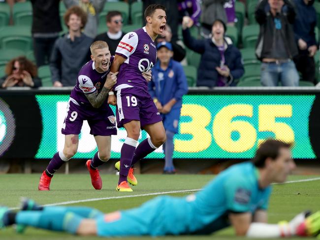Christopher Ikonomidis (right) of the Glory is congratulated by Andy Keogh after scoring a goal during the Round 5 A-League match between the Perth Glory and Central Coast Mariners at NIB Stadium in Perth, Sunday, November 25, 2018. (AAP Image/Richard Wainwright) NO ARCHIVING, EDITORIAL USE ONLY