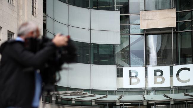 A member of the media works outside BBC Broadcasting House in central London. Picture: AFP.