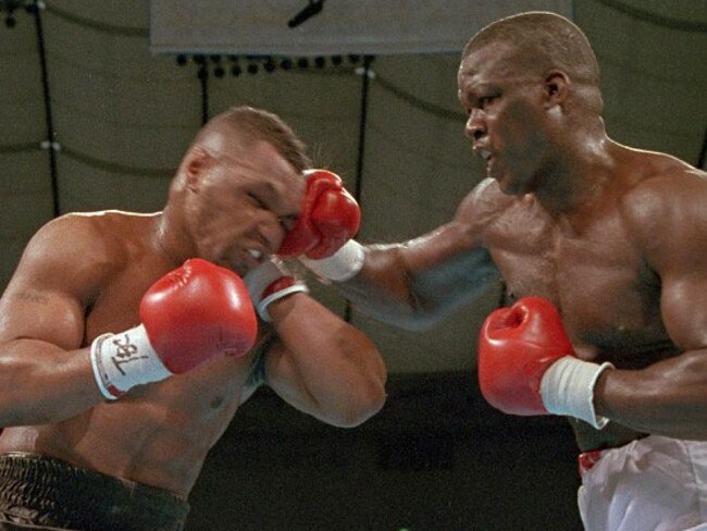 James “Buster” Douglas, right, hits Tyson with a hard right in the face during their world heavyweight title bout in Tokyo in 1990. The fight result was one of the most stunning upsets in sports history. Picture: Sadayuki Mikami/AP