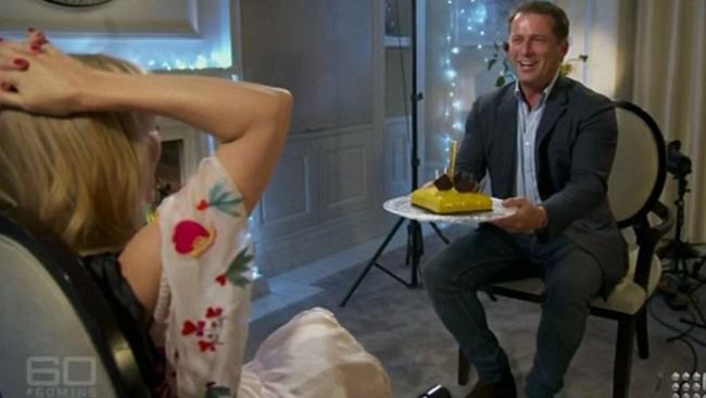 Karl Stefanovic gives Kylie Minogue a cake. Picture: Nine