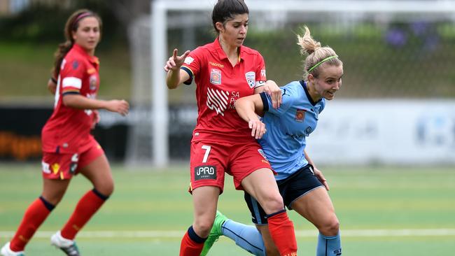 Georgia Yeoman-Dale (right) of Sydney competes for the ball with Stella Rigon (centre) of United during the round 4 W-League match between Sydney FC and Adelaide United at Seymour Shaw Park in Sydney on Sunday, Nov. 27, 2016. (AAP Image/Paul Miller) NO ARCHIVING, EDITORIAL USE
