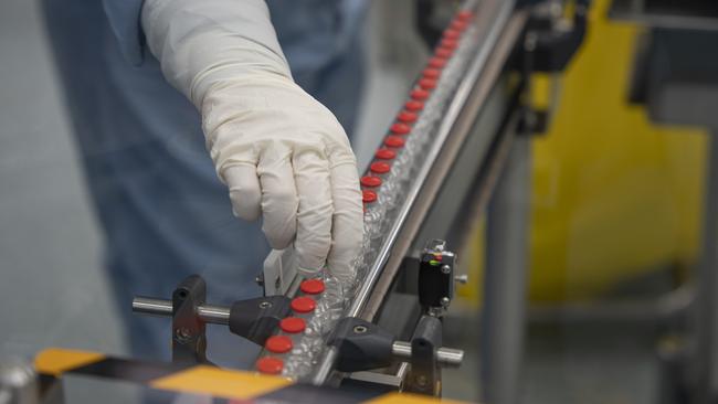 The first vials of locally produced AstraZeneca vaccine coming off the line in Victoria yesterday. Picture: Seqirus/CSL