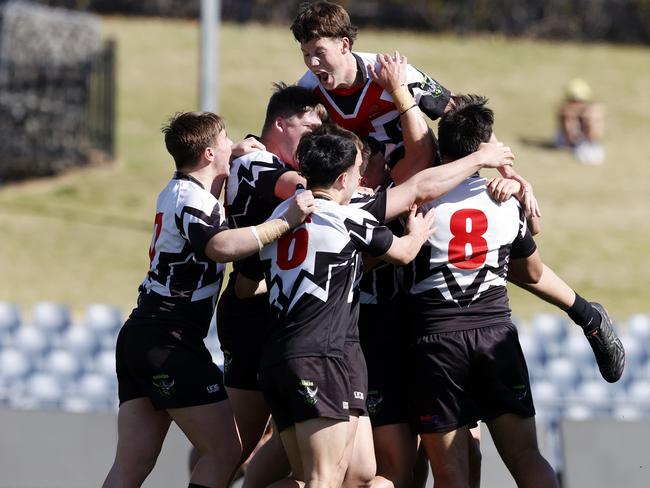 DAILY TELEGRAPH AUGUST 17, 2022. Erindale College celebrating winning their quarter-final game against Patrician Brothers Blacktown in the NRL Schoolboys Cup at Campbelltown Sports Stadium. Picture: Jonathan Ng