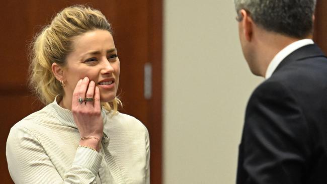 US actress Amber Heard looks on during a trial in the Fairfax County Circuit Courthouse in Fairfax, Virginia.