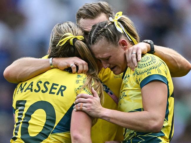 Australia's Maddison Levi and Isabella Nasser were devastated after the women's semi-final rugby sevens match between Canada and Australia. Picture: Carl De Souza/AFP