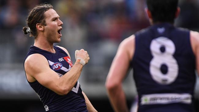 Hard-running wingman Ed Langdon has been traded from the Dockers to the Demons.