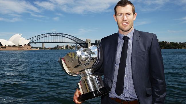 SYDNEY, AUSTRALIA - DECEMBER 02: Former Socceroos Brett Emerton poses with the Asian Cup trophy during the Asian Cup Trophy Tour at Sydney Harbour on December 2, 2014 in Sydney, Australia. (Photo by Matt King/Getty Images)