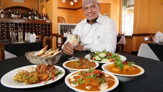 Kashi Poudel, owner of Taste of Nepal with his Himalayan Banquet. Picture: Stephen Laffer