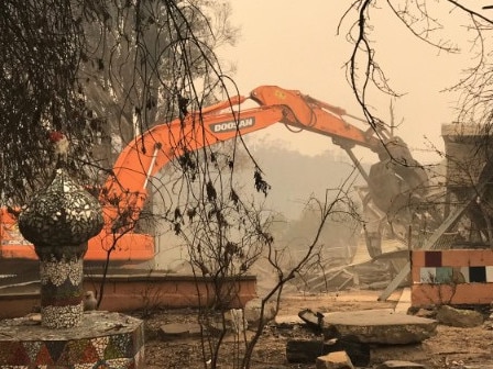 Supplied images of Clifton Creek school being demolished last week after bushfire damage.