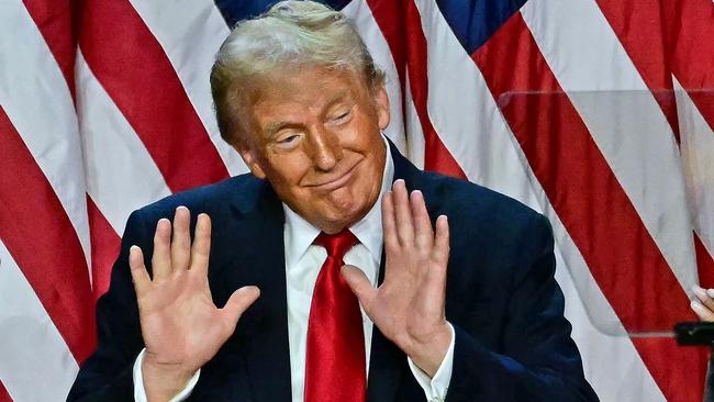 TOPSHOT - Former US President and Republican presidential candidate Donald Trump gestures after speaking during an election night event at the West Palm Beach Convention Center in West Palm Beach, Florida, on November 6, 2024. Republican former president Donald Trump closed in on a new term in the White House early November 6, 2024, just needing a handful of electoral votes to defeat Democratic Vice President Kamala Harris. (Photo by Jim WATSON / AFP)