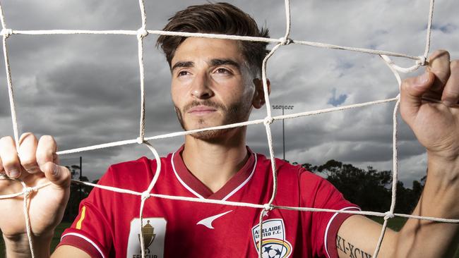 Josh Cavallo of the Adelaide United A-League Men's team poses during a portrait session at the Adelaide United Football Club Training Base. Picture: Sarah Reed/Getty Images