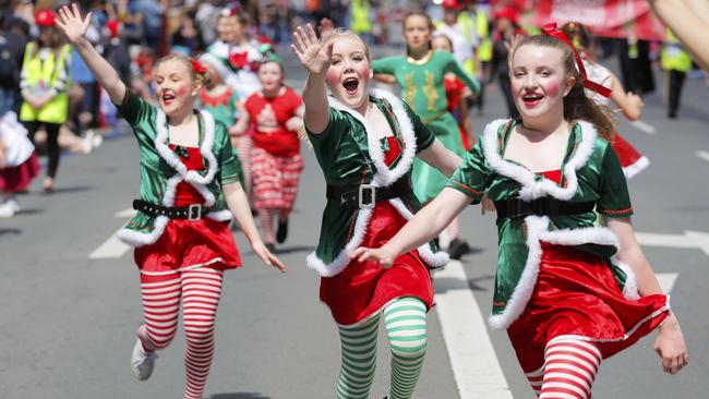 Elves skip their way along the Hobart Christmas Pageant route. Picture: RICHARD JUPE