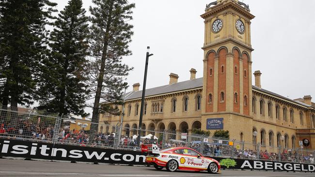 Crowds line the street near Customs House in Newcastle as Fabian Coulthard passes by. Picture: Darren Pateman