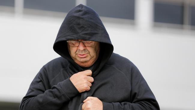 Brett Button leaves Cessnock police station the day after the crash. (Photo by Roni Bintang/Getty Images)