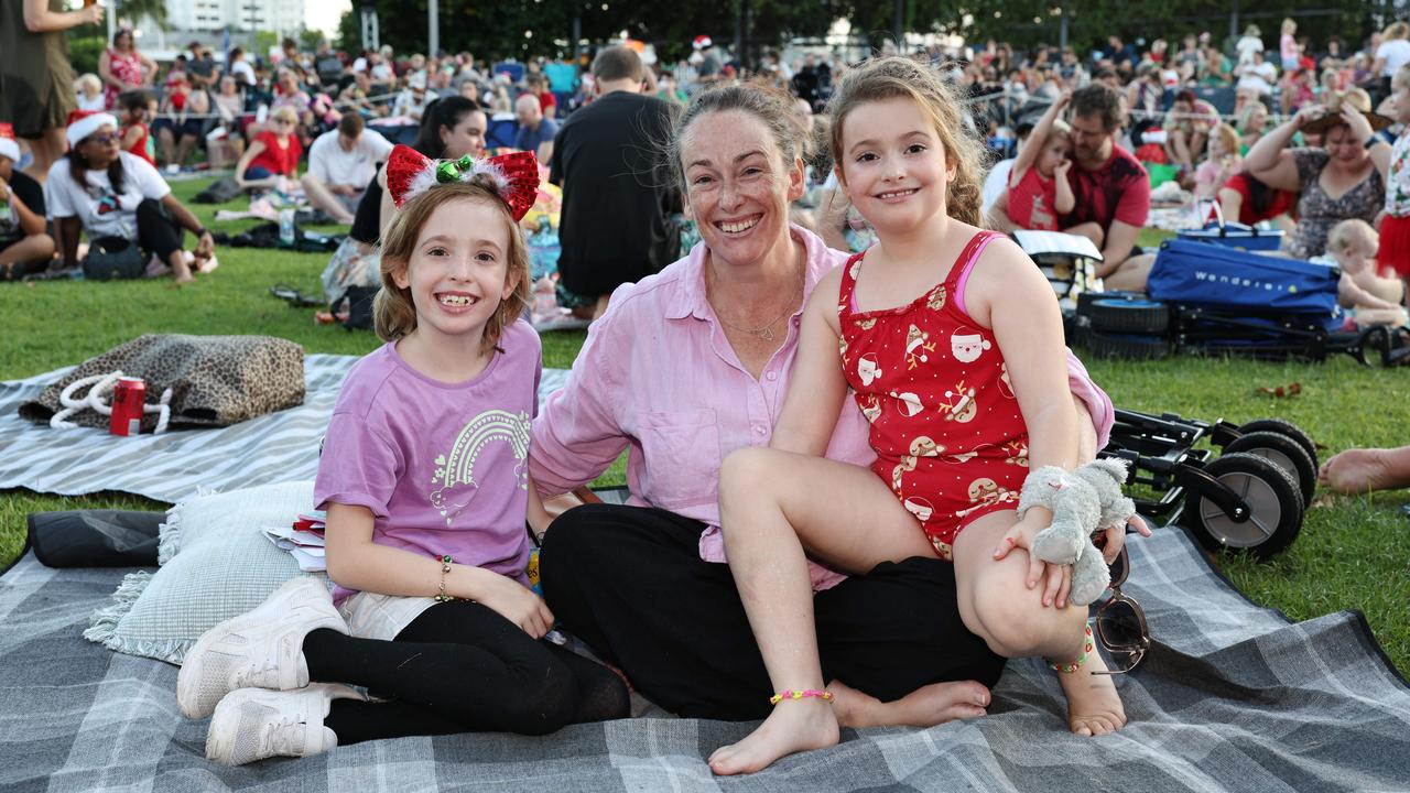 Jolene James, 8, Joni James and Henley James, 8, at the Carols in the Park, held at Munro Martin Parklands. Picture: Brendan Radke