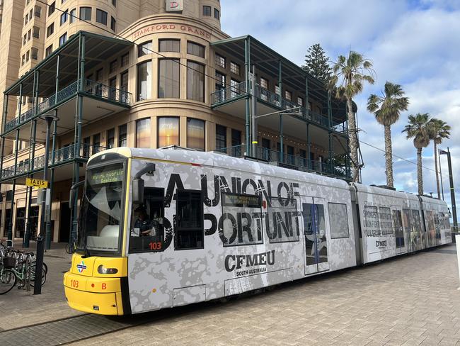 An Adelaide Tram at Glenelg with the CFMEU advertising. Picture: Jo Schulz